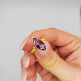Marquise-cut Amethyst framed with a brushed-matte 14k gold details and band . Hand-crafted for a luxurious feel and fit. Available in multiple sizes.
14k Yellow Gold
Marquise Amethyst
Available in multiple sizes
Hand Crafted