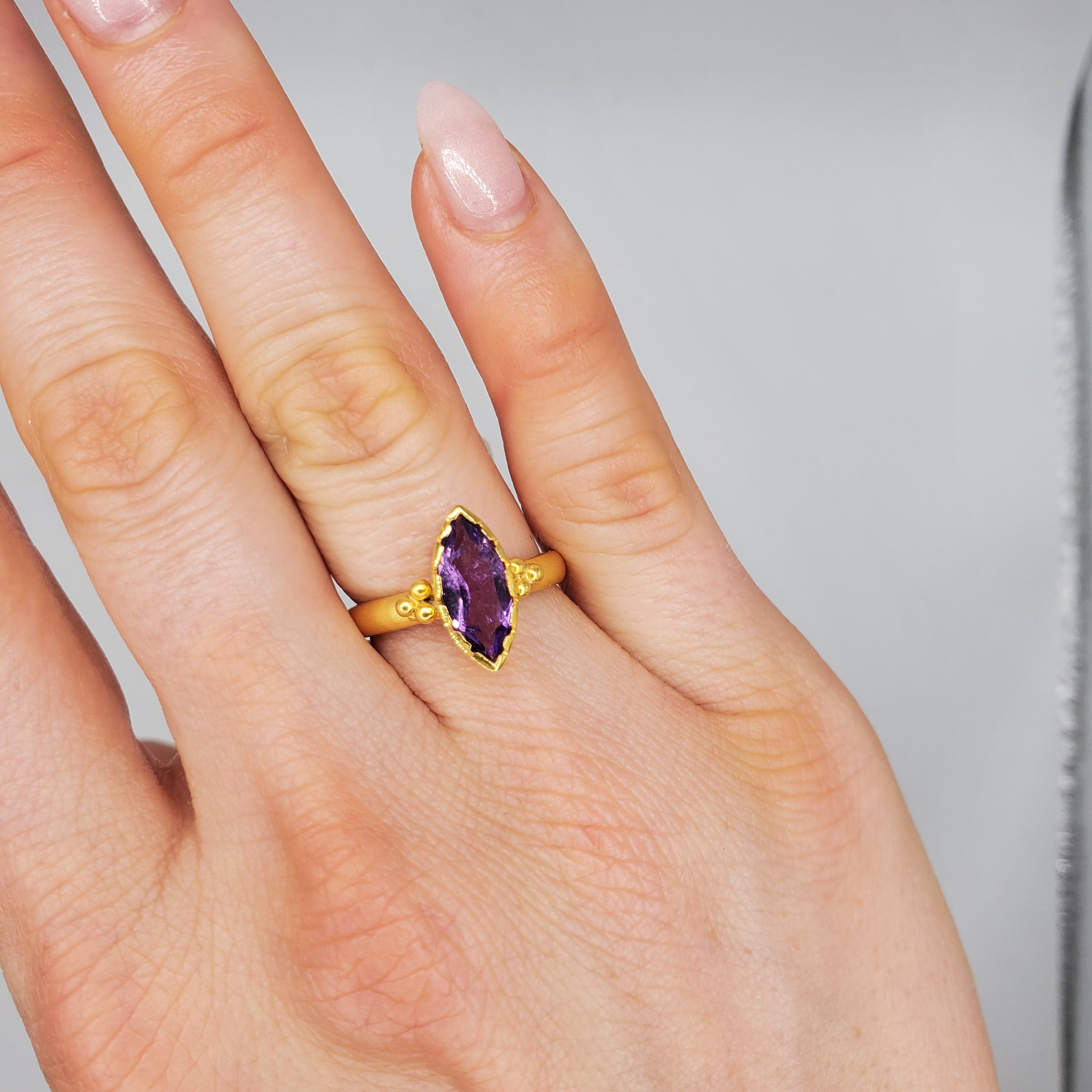 Marquise-cut Amethyst framed with a brushed-matte 14k gold details and band . Hand-crafted for a luxurious feel and fit. Available in multiple sizes.
14k Yellow Gold
Marquise Amethyst
Available in multiple sizes
Hand Crafted