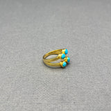 FOUR TURQUOISE OPEN GOLD RING
