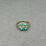 FOUR TURQUOISE OPEN 18KT GOLD RING