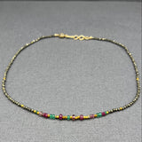 RUBY, PYRITE, ONYX, GOLD BEADED NECKLACE