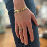 THREE EMERALD GOLD RING