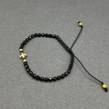 DIAMOND CROSS ON BLACK ONYX BEADED BRACELET