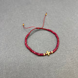 DIAMOND CROSS ON RUBY BEADED BRACELET