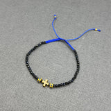 DIAMOND CROSS ON SAPPHIRE BEADED BRACELET