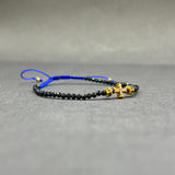 DIAMOND CROSS ON SAPPHIRE BEADED BRACELET