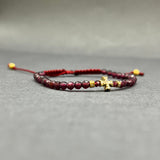 DIAMOND CROSS ON GARNET BEADED BRACELET