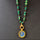 EMERALD SUN GOLD NECKLACE