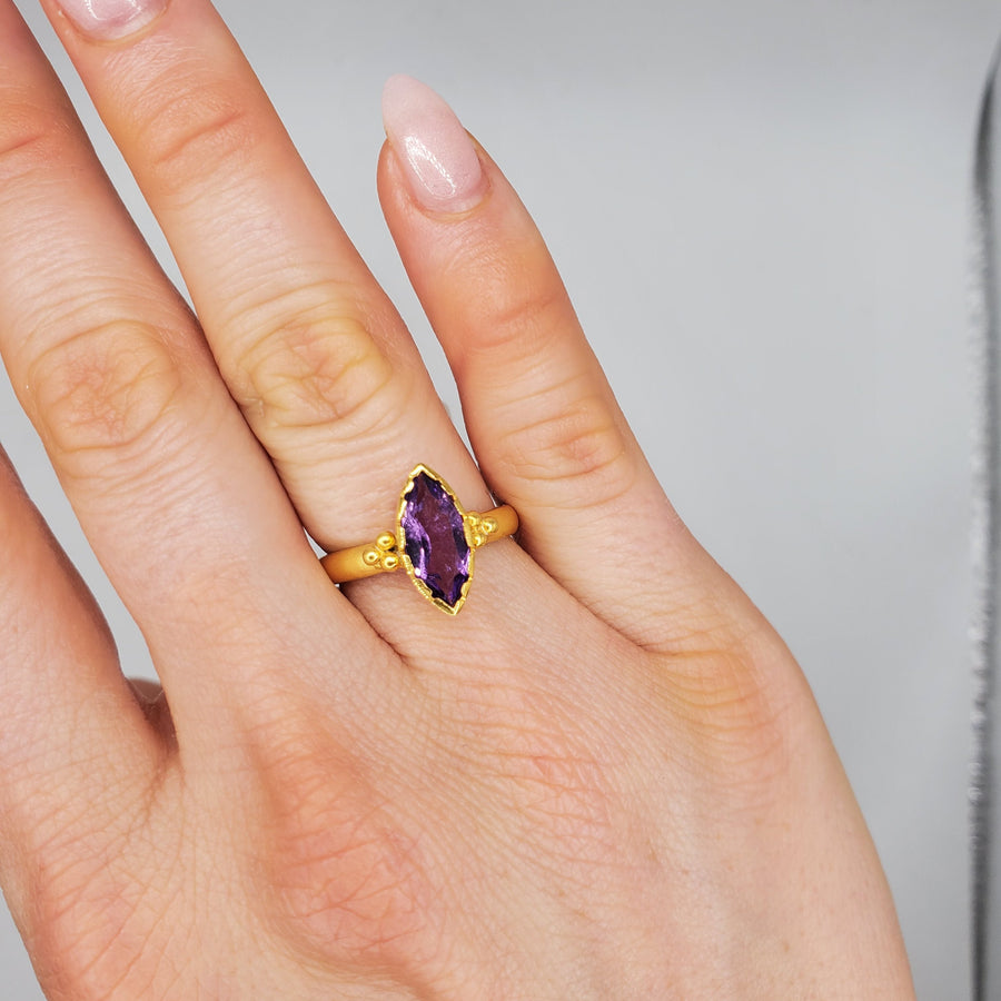 Marquise-cut Amethyst framed with a brushed-matte 14k gold details and band . Hand-crafted for a luxurious feel and fit. Available in multiple sizes.

14k Yellow Gold
Marquise Amethyst
Available in multiple sizes
Hand Crafted