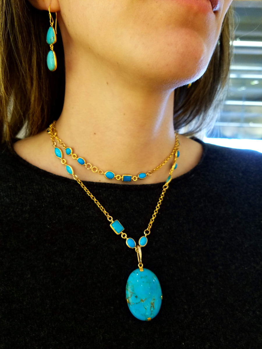 TURQUOISE MEDALLION ON TURQUOISE CHAIN