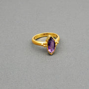 Marquise-cut Amethyst framed with a brushed-matte 14k gold details and band . Hand-crafted for a luxurious feel and fit. Available in multiple sizes.

14k Yellow Gold
Marquise Amethyst
Available in multiple sizes
Hand Crafted