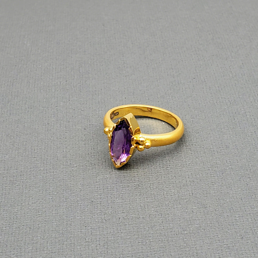 Marquise-cut Amethyst framed with a brushed-matte 14k gold details and band . Hand-crafted for a luxurious feel and fit. Available in multiple sizes.

14k Yellow Gold
Marquise Amethyst
Available in multiple sizes
Hand Crafted
