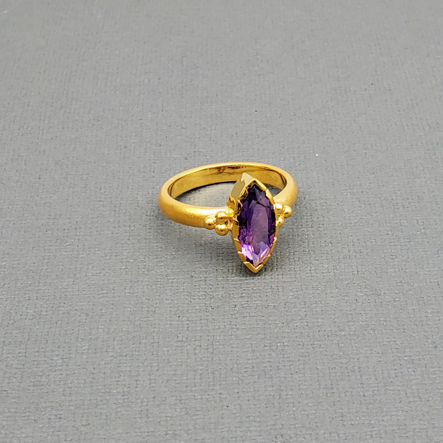 Marquise-cut Amethyst framed with a brushed-matte 14k gold details and band . Hand-crafted for a luxurious feel and fit. Available in multiple sizes.

14k Yellow Gold
Marquise Amethyst
Available in multiple sizes
Hand Crafted