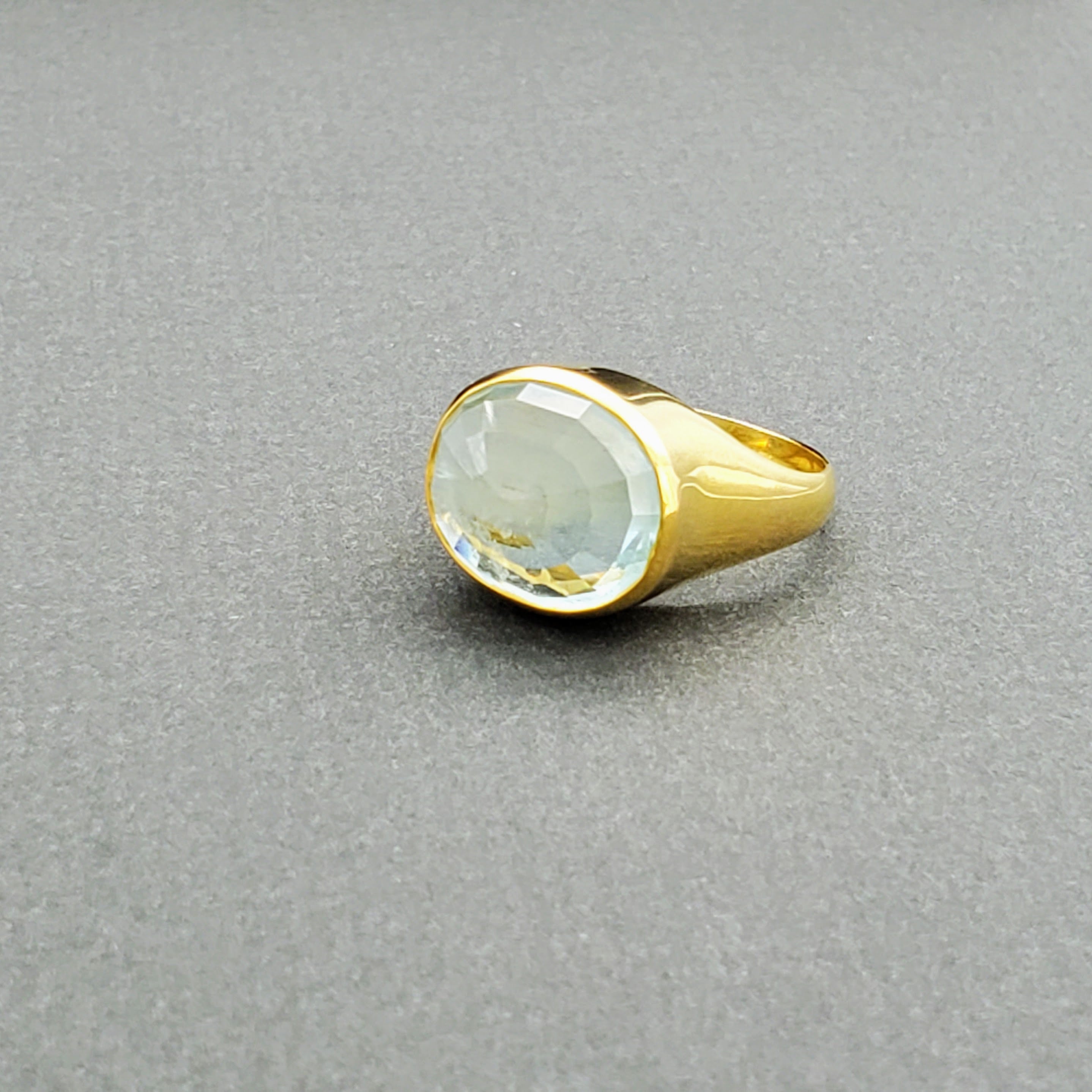 Hand Crafted 18kt Yellow gold ring with a clear umbrella cut Aquamarine stone. Available with an array of other gemstones for a personalized touch.

18 kt Yellow Gold
Aquamarine
Hand-Crafted
Available in a variety of gemstones