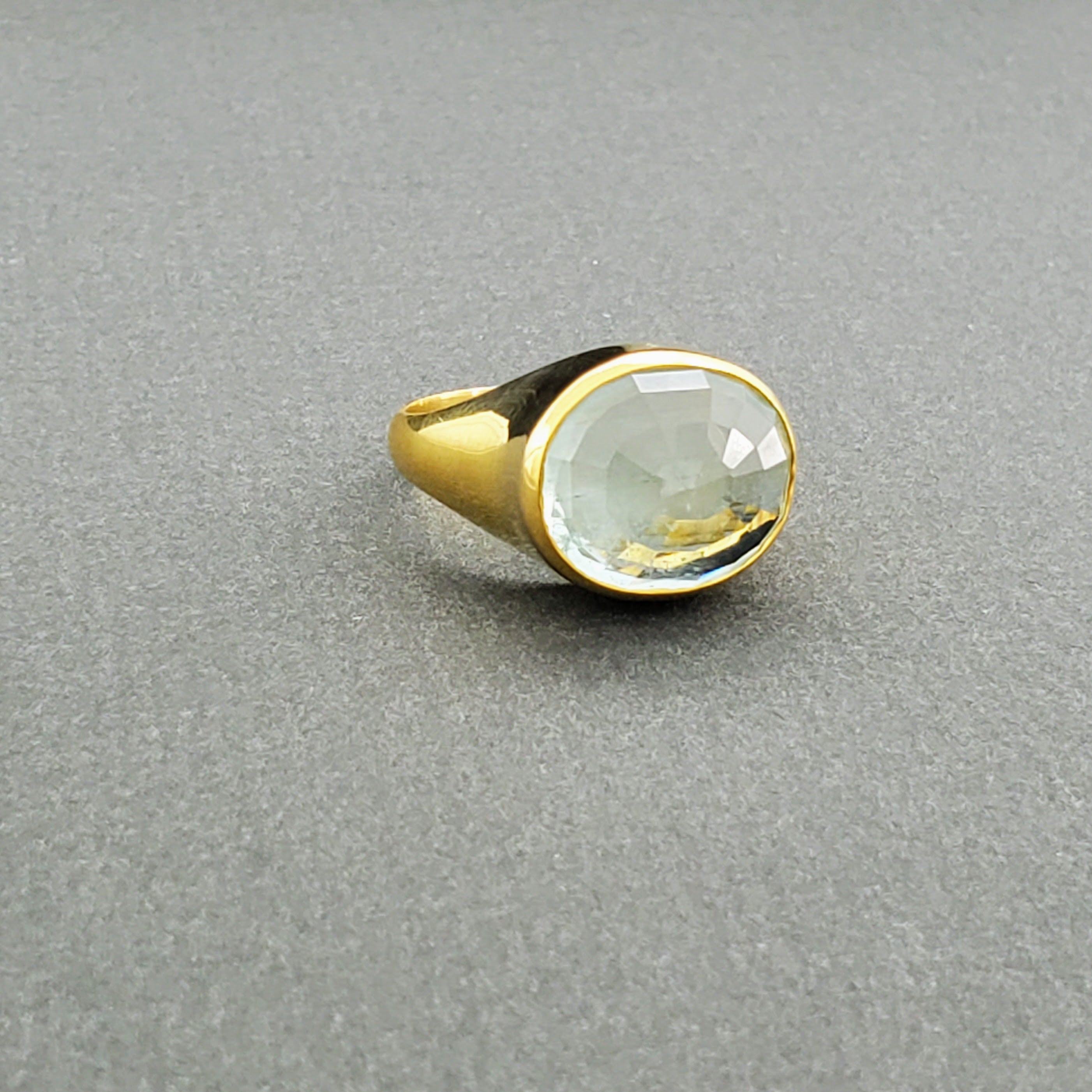 Hand Crafted 18kt Yellow gold ring with a clear umbrella cut Aquamarine stone. Available with an array of other gemstones for a personalized touch.

18 kt Yellow Gold
Aquamarine
Hand-Crafted
Available in a variety of gemstones