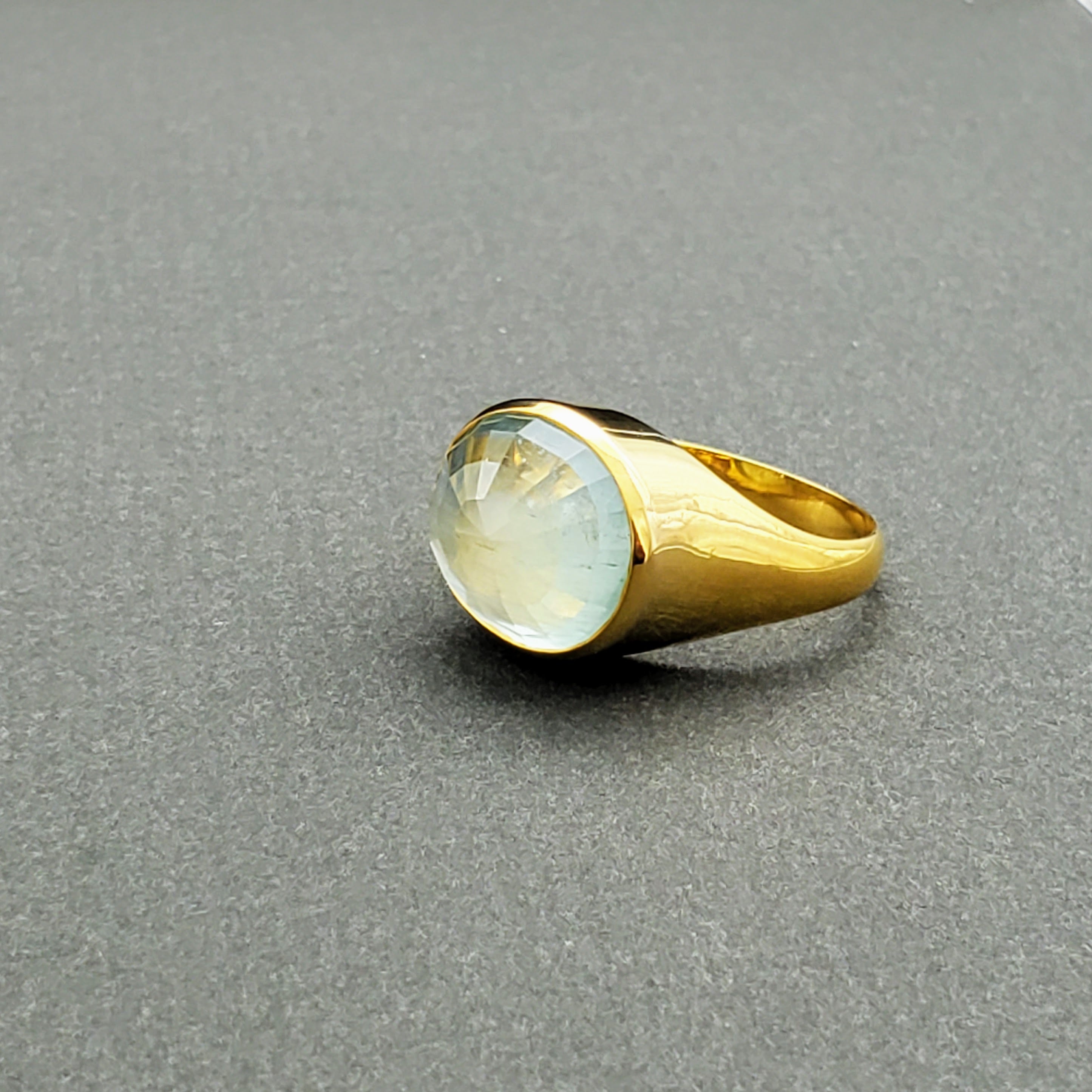 Hand Crafted 18kt Yellow gold ring with a clear umbrella cut Aquamarine stone. Available with an array of other gemstones for a personalized touch.

18 kt Yellow Gold
Aquamarine
Hand-Crafted
Available in a variety of gemstones